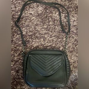 Black leather purse with front pocket, chain and leather strap